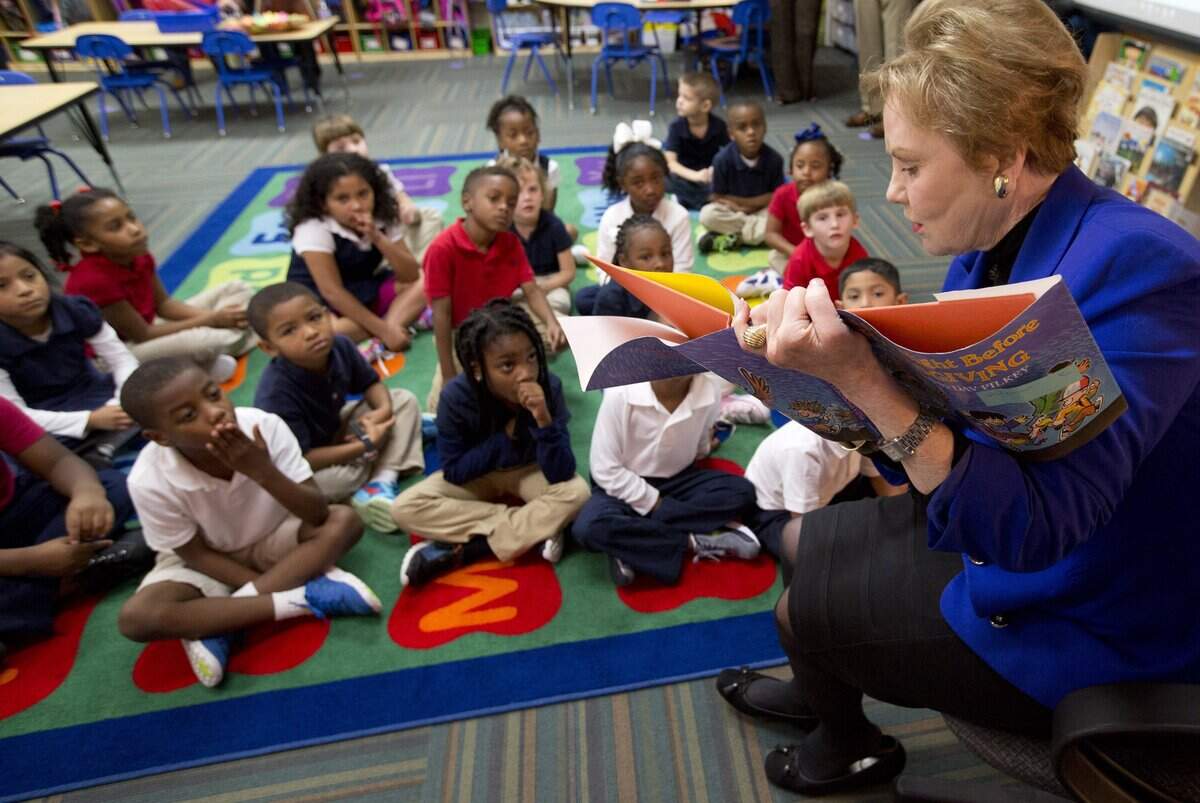 U.S. Rep. Kay Granger highlights literacy at an event at Lena Pope's Chapel Hill Academy public charter school on Thursday, November 10, 2016. Kay reads to a kindergarten class.